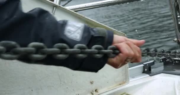 Man Manually Pulling Anchor Chain Boat Ocean Alaska Close — Video Stock
