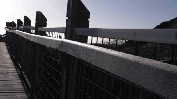 Empty Wooden Bridge Railings Wide Crane Shot – Stock-video