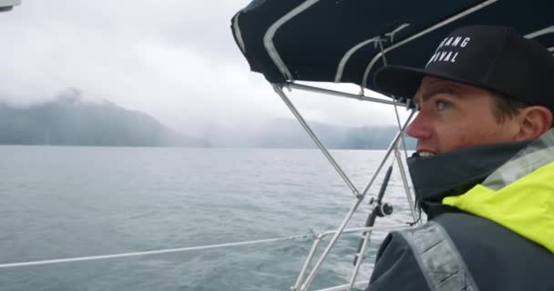 Caucasian Man Manually Pulling Rope Boat Winch While Sailing Ocean — Video