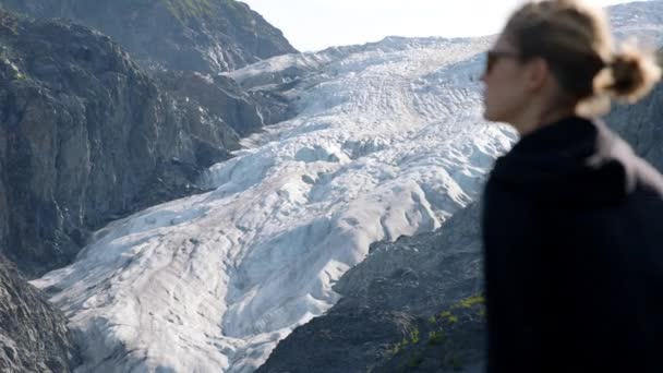 Female Standing Front Alaskan Glacier Slow Motion Changing Depth Focus — Stockvideo