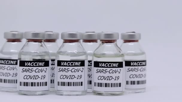 Corona Virus Vaccine Bottle White Background Panning Shot — Stockvideo