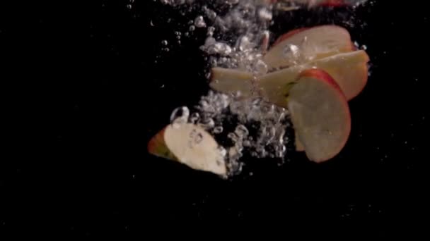 Apple Slices Falling Water Super Slowmotion Black Background Lots Air — 图库视频影像