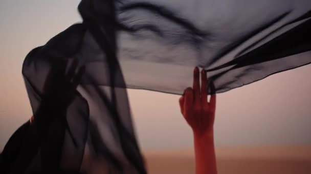Black Scarf Held While Wind Blowing Windy Desert United Arab — Stockvideo