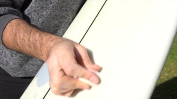 Detail Surfer Hand Putting Wax Board — Video