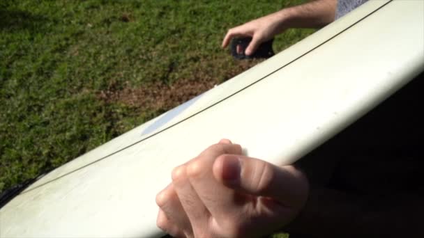 Detail Hands Surfer Removing Wax Board — Video