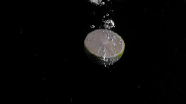 Lime Falling Water Super Slowmotion Black Background Lots Air Bubbles — Stockvideo
