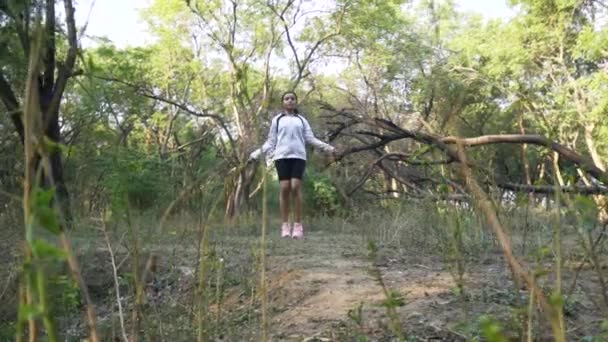 Athletic Beautiful Woman Exercises Jump Skipping Rope Forest Sporty Woman — Stock Video