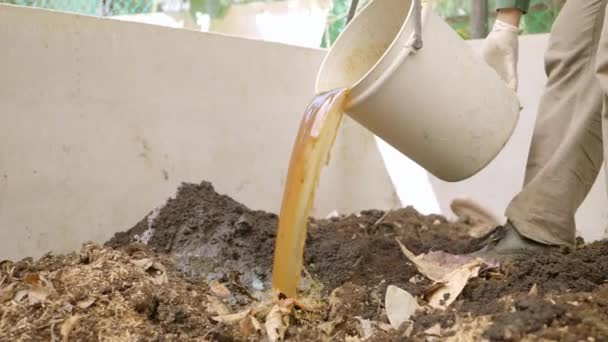 Pouring Water Fertilizer Pile Soil — ストック動画