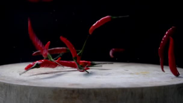Slow Motion Red Chili Peppers Dropped Cutting Board Scattered — Vídeo de Stock
