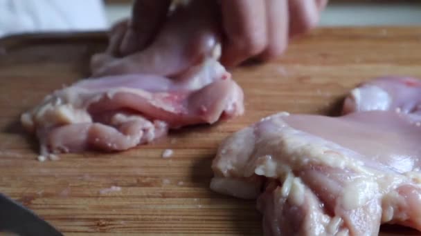 Person Cutting Raw Chicken Meat Wooden Board Kitchen Close Shot — ストック動画