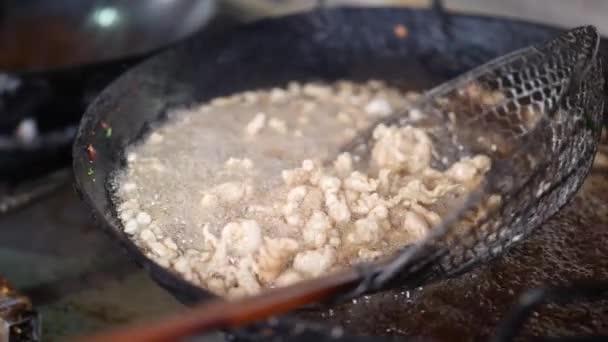 Slow Motion Scooping Chicken Boiling Frying Pan — Video