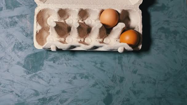 Stop Motion Two Organic Eggs Moving Egg Tray Overhead Shot — ストック動画