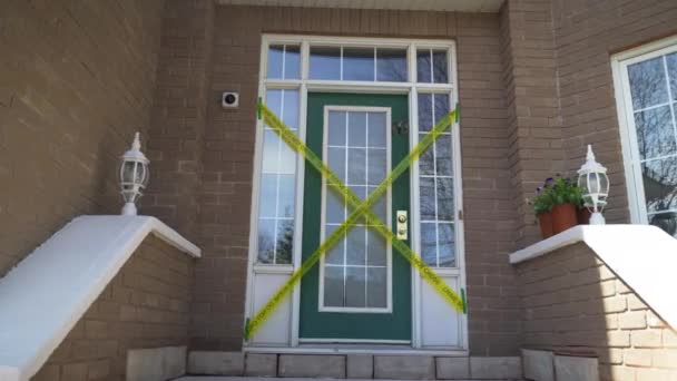 Crime Scene Cross Yellow Tape Front Door Brick Home Entranceway — Vídeo de stock