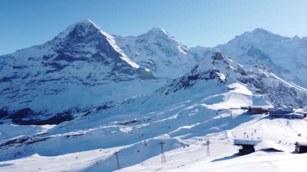 Beautiful Ski Area Foreground Eiger Mnch Jungfrau Background Lots Snow — стоковое видео