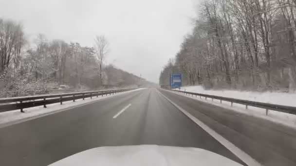 Driving Car German Motorway Wintertime Snow Framing Road Front Window — Vídeos de Stock