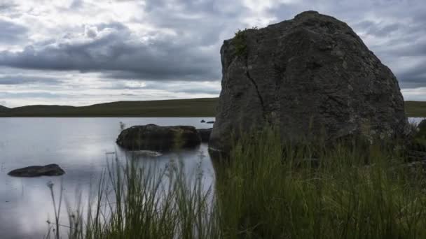 Time Lapse Lake Grass Large Rocks Foreground Dark Cloudy Summer — Stok video