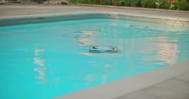 Electric Pool Cleaning Robot Cleans Swimming Pool Floor Power Cable — Stockvideo