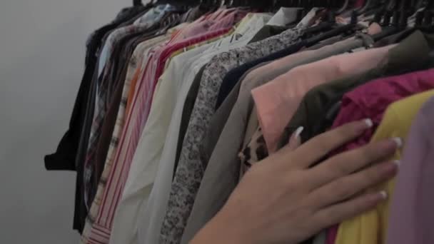 Woman Hand Crosses Shirts Hung Hanger — Video Stock
