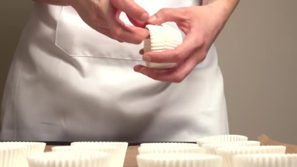 Woman Placing Muffin Molds Tray Brown Baking Paper — Stock Video