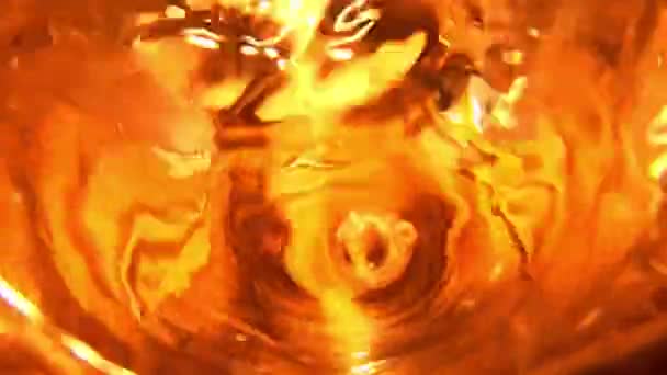 Close Pouring Water Glass Top View Golden Effect — Stockvideo