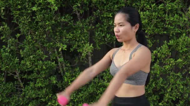 Sporty Thai Woman Exercising Dumbbells Stretching Arms Forward Sideways Medium — Wideo stockowe
