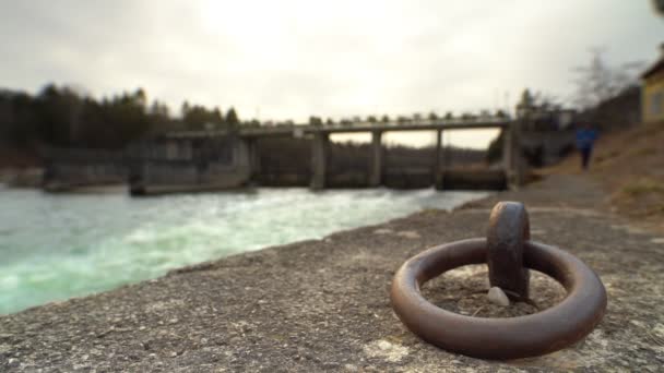 Watching Flowing Water Coming Weir While Unfocused Man Walking Direction — Stockvideo