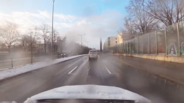 Winter Drive Munich City Snowflakes Windshield View Wet Conditions Sunny — Stockvideo