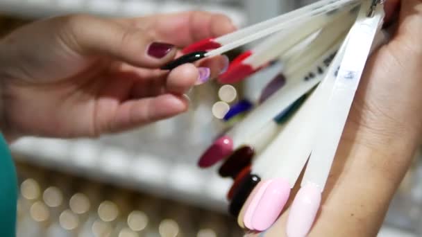 Woman Browsing Choosing Nail Colors Shop — Stockvideo