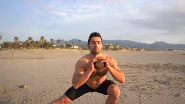 Shirtless Man Performing Functional Exercises Kettlebell Beach Sunrise Slow Motion — Stockvideo