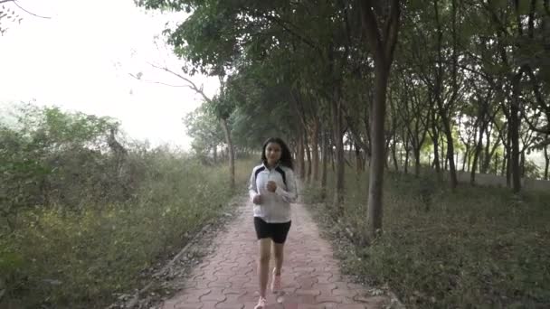 Woman Jogging Outdoors Slow Motion Video — Vídeo de Stock