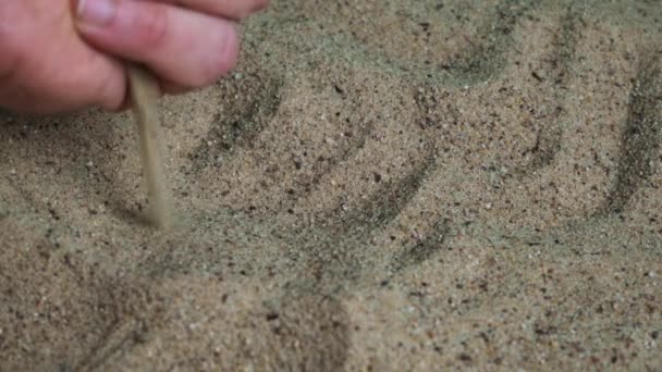 White Male Hand Picks Sand Lets Slide Out Side His — Stockvideo