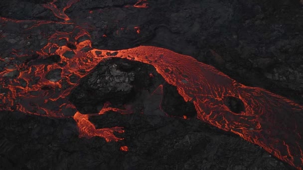 Red Lava River Flowing Slowly Black Solidified Rocks Aerial Static — Vídeo de Stock