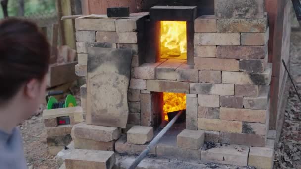 Woman Tends Embers Her Wood Fired Kiln Preparation Fire Her — ストック動画