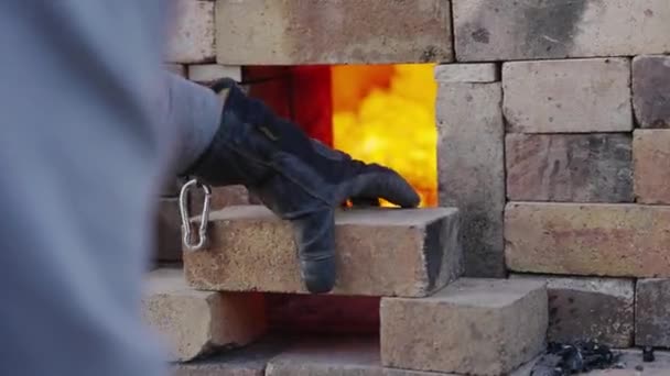 Person Stacking Bricks Front Opening Kiln Control Air Flow Heat — Stok video