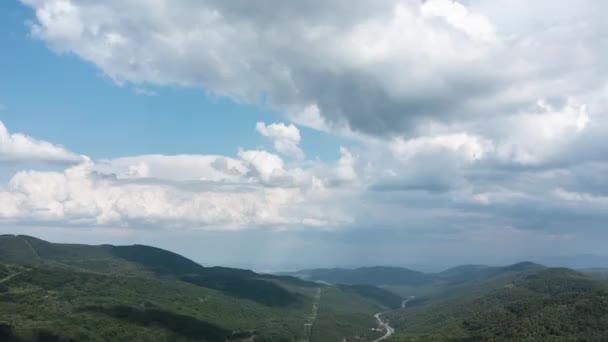 Aerial Hyperlapse Fast Moving Clouds Forest Green Hills — Stockvideo