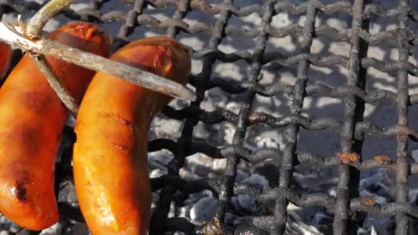 Three Sausages Being Cooked Simple Concrete Outdoor Grill Skin Sausages — Stock Video