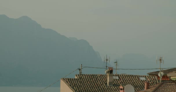 Full Shot Roof Top Chimneys Malcesine Showing Mountain Range North — Wideo stockowe