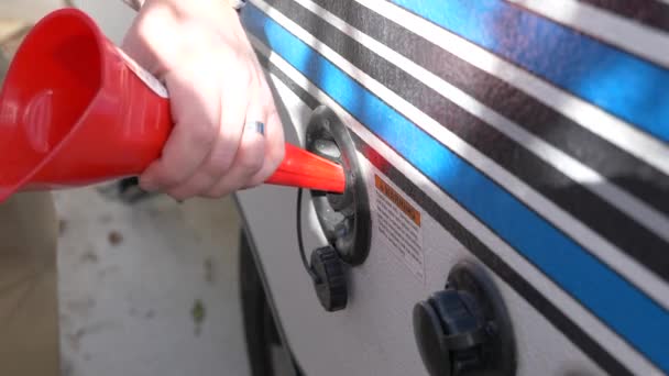 Guy Winterizing His Camper Pouring Antifreeze Funnel His Camper Sink — Vídeo de Stock