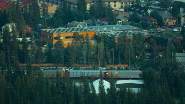 Canadian Pacific Train Passing Banff Town — Stockvideo