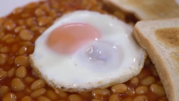 Fried Egg Top Cooked Beans Toasted Bread Close — Vídeos de Stock