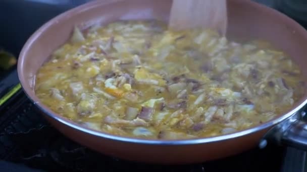 Wooden Spoon Cooking Beaten Eggs Chopped Onions Pan Close — Stockvideo