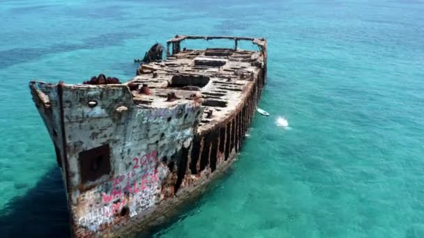 Drone Aerial View Female Person Jumping Shipwreck Turquoise Sea Water — Video