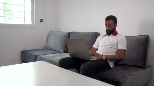 Annoyed Man Working Typing His Laptop While Sitting Sofa Medium — Stockvideo