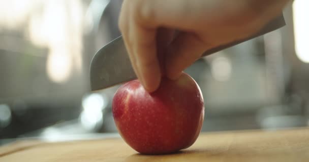 Young Guy Cutting Apple Wooden Table Kitchen Prepare Fruit Milkshake — ストック動画