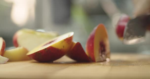 Young Guy Cutting Peach Wooden Table Kitchen Prepare Fruit Milkshake — ストック動画