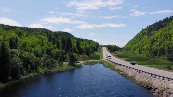 White Semi Truck Drives Highway Surrounded Forests Mountains Next Lake — Video
