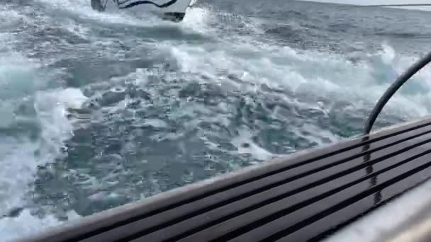 View Ship Pulling Boat Choppy Sea Stern — Stockvideo