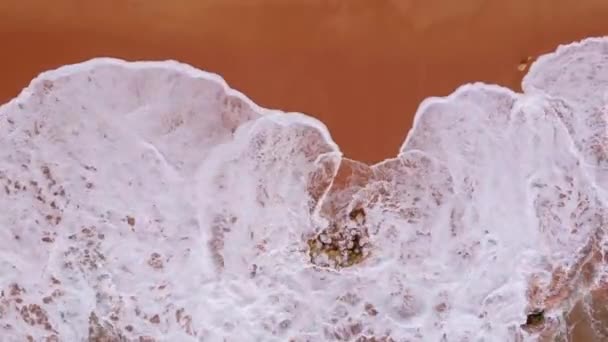 Waves Crashing Rock Surrounded Red Sand Ferragudo Portugal Aerial — Stockvideo