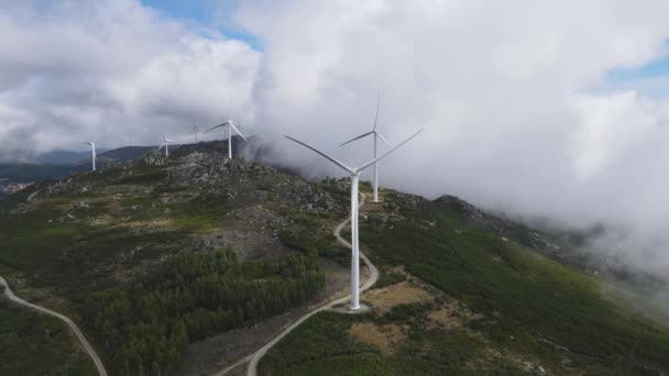 Mountain Shrouded Clouds Slowly Spinning Wind Turbines Blades Aerial Orbit — 비디오