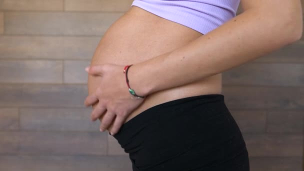 Pregnant Woman Third Trimester Touches Gently Belly Static Side Shot — Stock Video